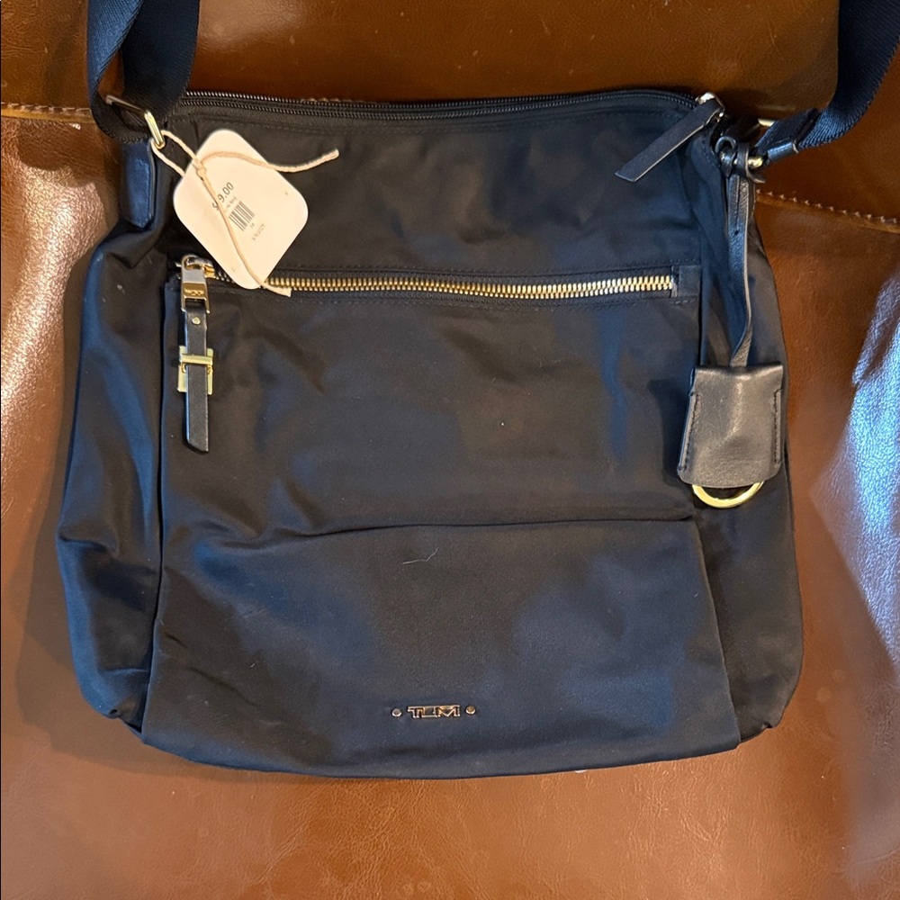 Tumi Canton Black Crossbody Bag with Gold Details